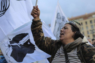 Residents of the Corsica island take the streets in Ajaccio, France, as they demonstrate ahead of a visit to the Mediterranean island next week by French President Emmanuel Macron, Saturday, Feb. 3, 2018. The newly elected leaders on the French Mediterranean island hope that Saturday's march will spur on fresh talks with the French government about demands including equal status for the Corsican language and the release of Corsican prisoners held in mainland prisons. (AP Photo/Raphael Poletti)