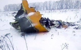 In this screen grab provided by the Life.ru, the wreckage of a AN-148 plane is seen in Stepanovskoye village, about 40 kilometers (25 miles) from the Domodedovo airport, Russia, Sunday, Feb. 11, 2018. Russia's Emergencies Ministry says a passenger plane has crashed near Moscow and fragments of it have been found. (Life.ru via AP)