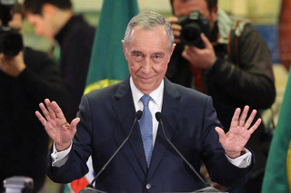 FILE - In this Sunday, Jan. 24, 2016 file photo, Marcelo Rebelo de Sousa addresses journalists and supporters after winning Portugal's presidential election, in Lisbon. Marcelo Rebelo de Sousa has been sworn in as Portugal's new president Wednesday March 9, 2016, making an appeal for prudent government spending after a recent financial crisis as well as a new focus on generating growth and jobs. (AP Photo/Armando Franca, File)