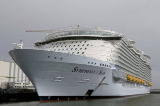 The Symphony of the Seas docks at Saint Nazaire port, western France, Friday, March 23, 2018. Royal Caribbean International took delivery of the much-awaited, 228,081-ton Symphony of the Seas from the French shipyard STX. Harmony of the Seas is the world's largest cruise ship. (AP Photo/David Vincent)