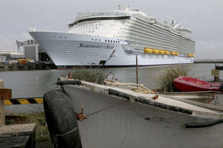 The Symphony of the Seas docks at Saint Nazaire port, western France, Friday, March 23, 2018. Royal Caribbean International took delivery of the much-awaited, 228,081-ton Symphony of the Seas from the French shipyard STX. Harmony of the Seas is the world's largest cruise ship. (AP Photo/David Vincent)