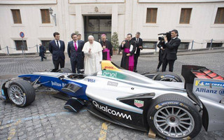 Pope Francis blesses the Formula E electric official car, at the Vatican, Wednesday, April 11, 2018. A Formula E race will be held in Rome EUR district, Saturday, April 14. (Vatican Media via AP)