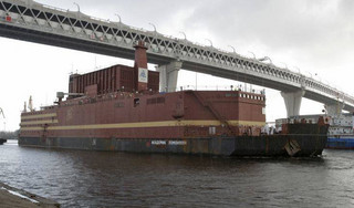 The floating nuclear power plant, the 'Akademik Lomonosov', is towed out of the St. Petersburg shipyard where it was constructed in St.Petersburg, Russia, Saturday, April 28, 2018. The Akademik Lomonosov is to be loaded with nuclear fuel in Murmansk, then towed to position in the Far East in 2019.(AP Photo/Dmitri Lovetsky)