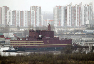 The floating nuclear power plant, the 'Akademik Lomonosov', is towed out of the St. Petersburg shipyard where it was constructed in St.Petersburg, Russia, Saturday, April 28, 2018. The Akademik Lomonosov is to be loaded with nuclear fuel in Murmansk, then towed to position in the Far East in 2019. (AP Photo/Dmitri Lovetsky)