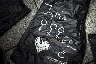 A plastic black bag painted with the word, ''Justice'' during a protest against sexual abuse in Pamplona, northern Spain, Saturday, April 28, 2018. Women's rights groups protest after a court in Pamplona sentenced five men to nine years each in prison for sexual abuse in what activists saw as a gang rape during the 2016 running of the bulls festival in Pamplona. (AP Photo/Alvaro Barrientos)