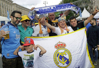 Real Madrid fans gather at a fan-zone in Kiev, Ukraine, Friday, May 25, 2018 ahead of Saturday's Champions League soccer match final between Real Madrid and Liverpool. (AP Photo/Sergei Grits)
