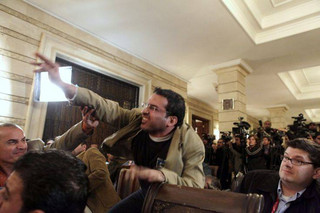 **FILE** In this Dec. 14, 2008 file photo, Iraqi journalist Muntadhar al-Zeidi throws a shoe at President George W. Bush during a new conference with Iraq Prime Minister Nouri al-Maliki in Baghdad, Iraq. The Iraqi journalist detained after throwing his shoes at President George W. Bush is in good shape and was allowed to meet with his brother on Friday Jan. 16, 2009, although he has been denied access to his lawyer, his family said.  (AP Photo/Evan Vucci, File)