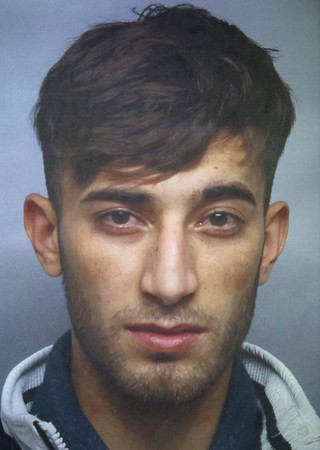 The search photo provided by Wiesbaden, western Germany, police shows 20-years-old Iraqi Ali Basar who is suspected of raping and killing a 14-years-old girl. (Polizei Wiesbaden via AP) The search photo provided by Wiesbaden, western Germany, police shows 20-years-old Iraqi Ali Basar who is suspected of raping and killing a 14-years-old girl. (Polizei Wiesbaden via AP)