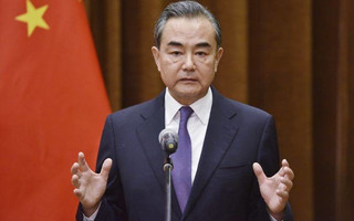 Chinese Foreign Minister Wang Yi speaks about the summit between U.S. President Donald Trump and North Korean leader Kim Jong Un, during a joint briefing with Association of South East Asian Nations (ASEAN) Secretary-General Lim Jock Hoi at the Foreign Ministry in Beijing Tuesday, June 12, 2018. (Greg Baker/Pool Photo via AP)