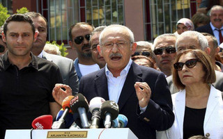 Kemal Kilicdaroglu, main opposition Republican People's Party leader, speaks to journalists after he cast his ballot at a primary school in Ankara, Turkey, Sunday, June 24, 2018. Polls opened Sunday for Turkey's high-stakes presidential and parliamentary elections, which could consolidate President Recep Tayyip Erdogan's hold on power or curtail his vast political ambition. (AP Photo/Ali Unal)