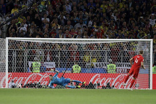 England's Eric Dier scores the wining penalty during the round of 16 match between Colombia and England at the 2018 soccer World Cup in the Spartak Stadium, in Moscow, Russia, Tuesday, July 3, 2018. England eliminates Colombia 4-3 on penalties after the game ends 1-1. (AP Photo/Matthias Schrader)