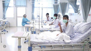 In this image made from video, released by the Thailand Government Spokesman Bureau, three of the 12 boys are seen recovering in their hospital beds after being rescued along with their coach from a flooded cave in Mae Sai, Chiang Rai province, northern Thailand. (Thailand Government Spokesman Bureau via AP)