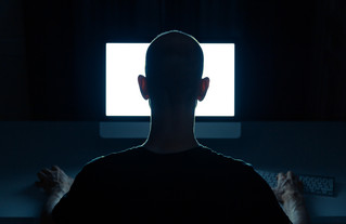 Man standing in front of a white screen