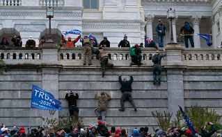 People hang from the wall in the US Capitol