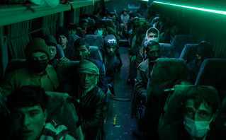 Refugees from Afghanistan on a bus