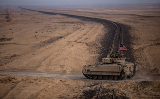 US troops drive a Bradley fighter jet into Syria