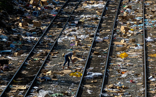 Thousands of cardboard boxes on train tracks