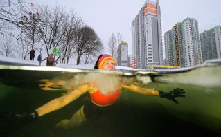 Swimmer in icy waters