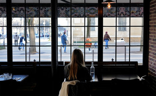 Woman sitting in a restaurant in Paris Woman sitting in a restaurant in Paris