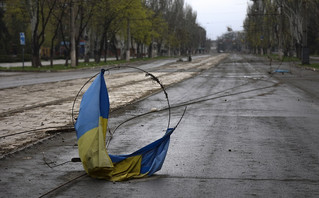 A Ukrainian national flag on a wire on the ground in an area controlled by Russian-backed separatist forces in Mariupol, Ukraine, Monday, April 18, 2022 A Ukrainian national flag on a wire on the ground in an area controlled by Russian-backed separatist forces in Mariupol, Ukraine, Monday, April 18, 2022