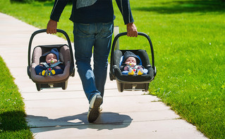 Twin baby boys in seats