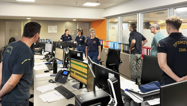 Greek PM visits crisis centre as wildfire damage survey begins