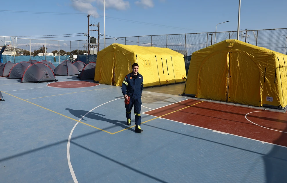 a man walking on a basketball court