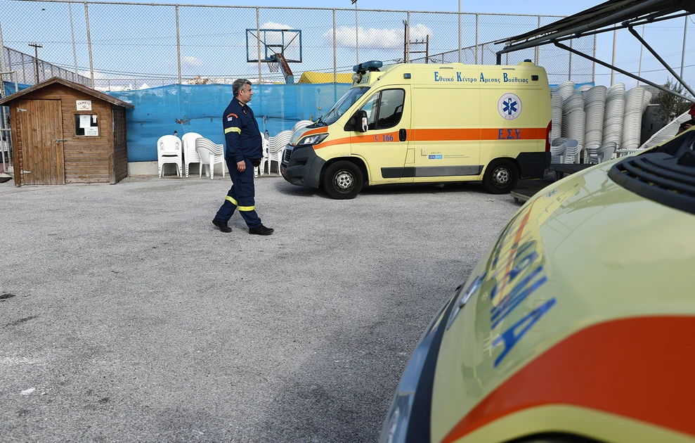 a man walking next to a yellow van