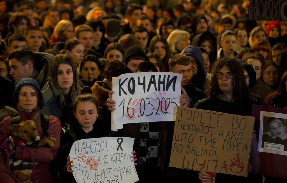 a group of people holding signs