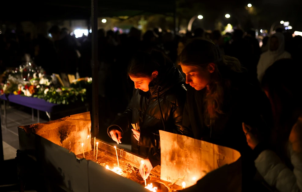 a group of people lighting candles