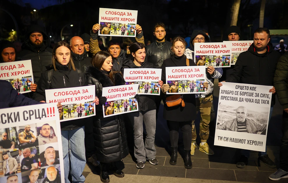 a group of people holding signs