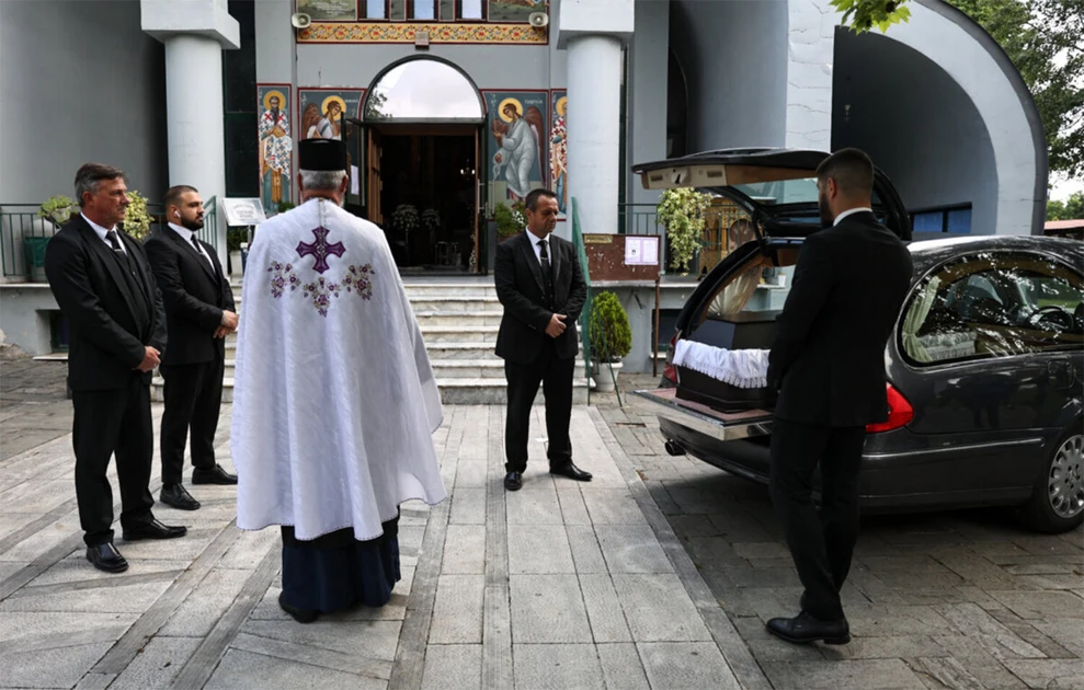 a group of men standing outside a building
